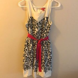 Black and white patterned dress with pink sash